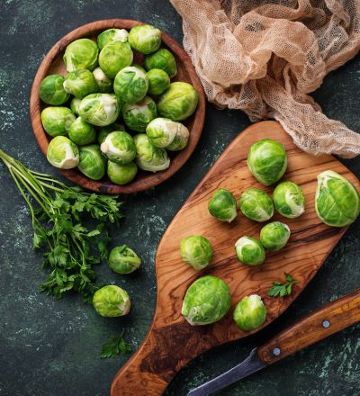 Brussels sprouts on green concrete background